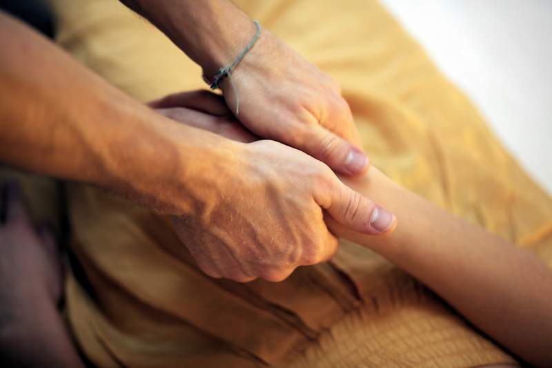 Demonstration of Thai massage working on the belly